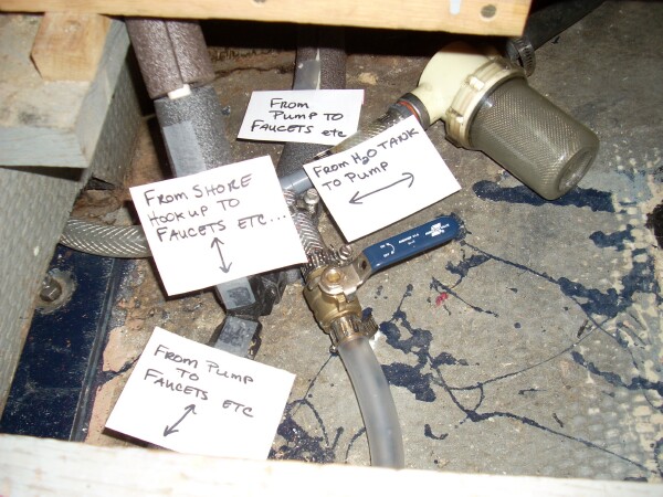 placards show what and where.  ball valve, my design, allows for tank to drain into sump for winterizing.